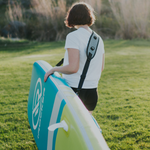 Person carrying the SUP with the irocker carry strap| Bundle