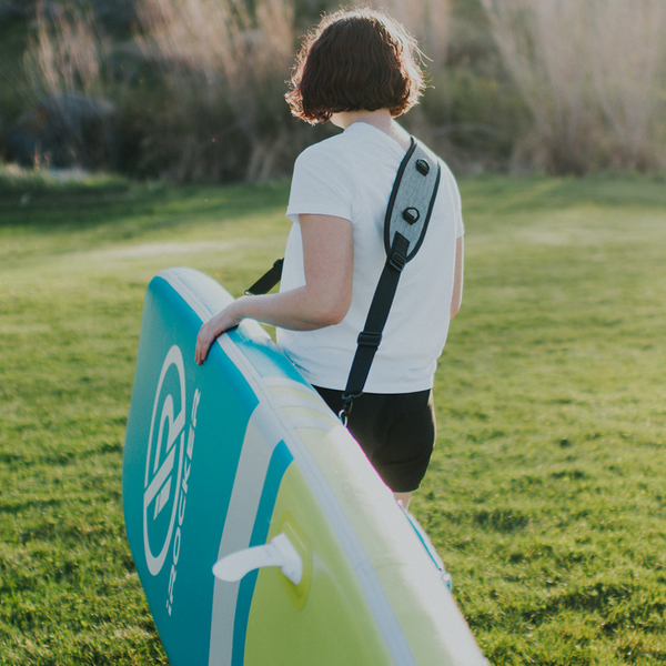 Person carrying the SUP with the irocker carry strap Bundle