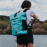 Person paddling with the irocker backpack cooler| Bundle